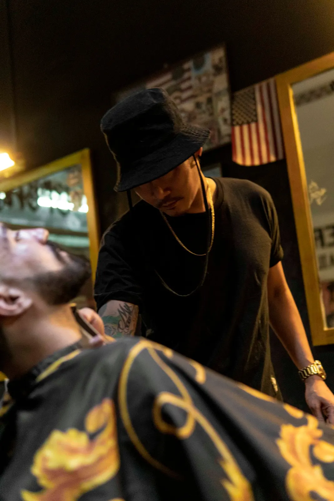 Barber working with clippers in a shop