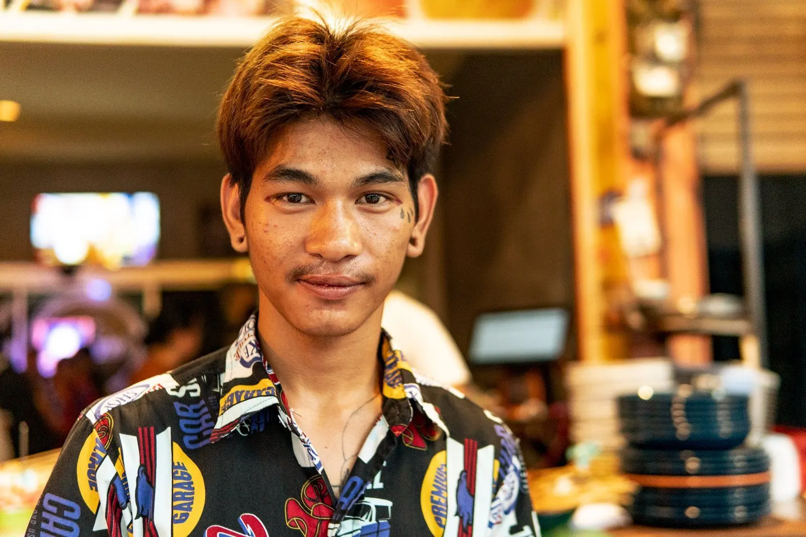 cook at restaurant with gang tattoos