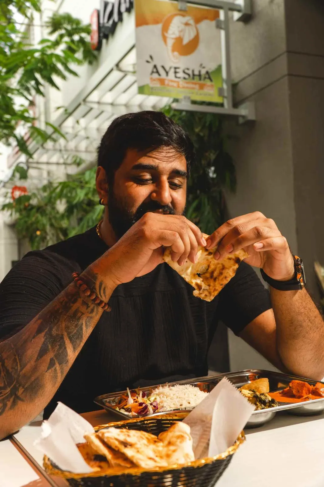 Person eating a meal at a restaurant