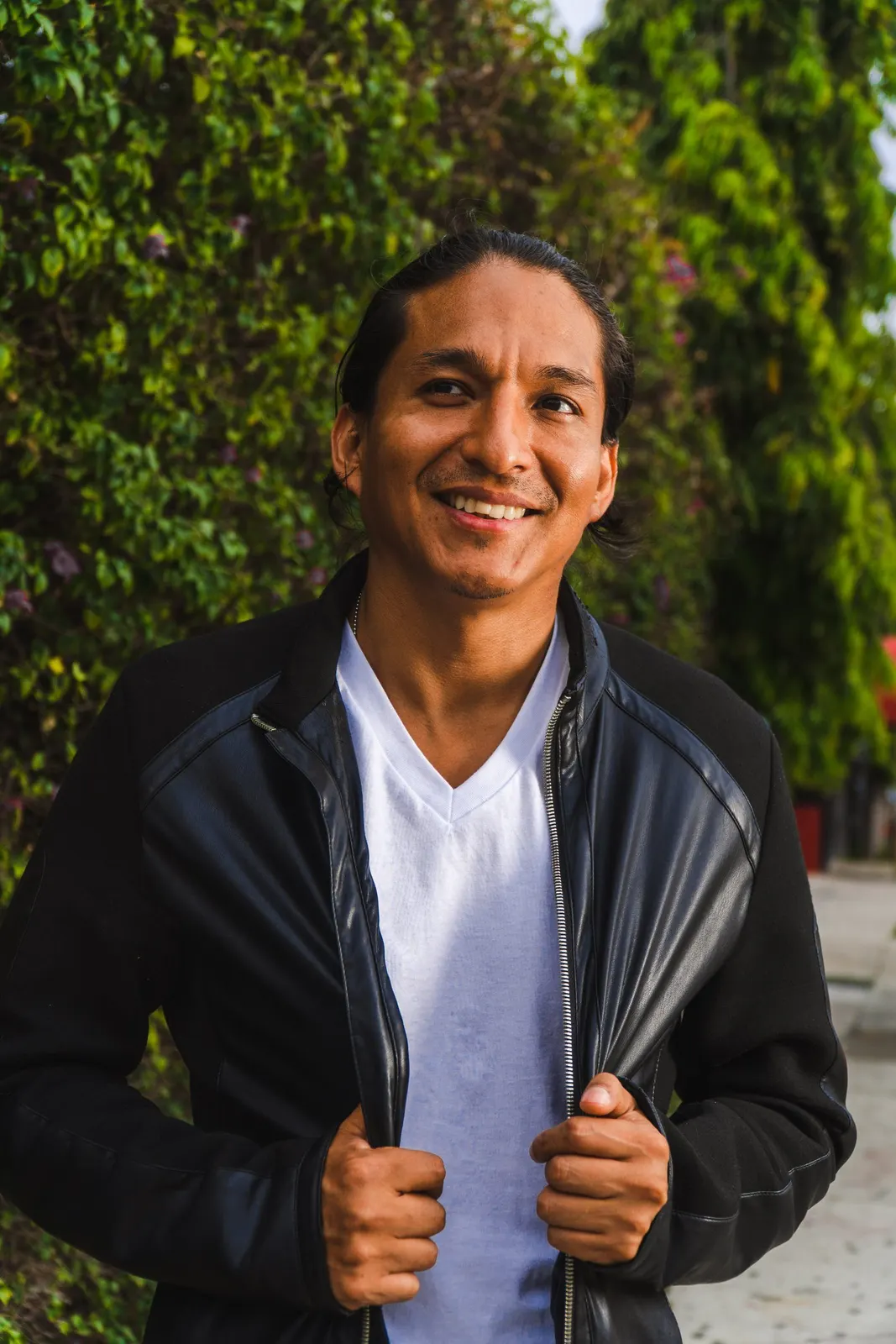 Smiling man in a jacket outdoors