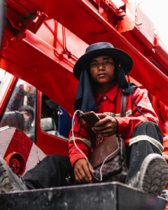 man in thailand on red fire truck